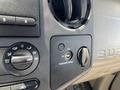 Close-up of the dashboard controls of a 2008 Ford F-450 SD showing knobs for climate control and an airbag switch