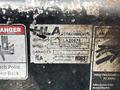 A worn sticker on a Kubota M8540D tractor showing the model number FN084A0600 serial number LA20876 and manufacturer information from Horst made in Canada