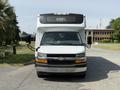 A 2020 Chevrolet Express van with a white exterior and a black front grill displaying the word Sorry on the windshield