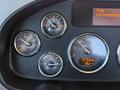 Dashboard of a 2019 Peterbilt 337 showing various gauges including fuel, oil pressure, exhaust temperature, and an RPM counter