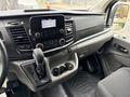 2023 Ford Transit interior showing dashboard gear shift and console with audio system and controls