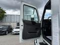 A 2022 International MV607 truck with its driver's side door open showing the interior and rearview mirror