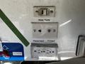 Control panel of a 2000 Ford Motorhome featuring switches and inputs for water pump phone and TV with 110V receptacles