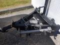 2004 Royal 18 Foot Office Trailer with a black trailer hitch and secure chain, including a metal support arm and cable system