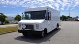 A white 2011 Ford Econoline box truck with a flat front and large windshield parked on a pavement surface