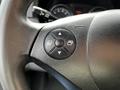 A close-up of the steering wheel of a 2017 Mercedes-Benz Sprinter showing a multi-directional control button with four arrows
