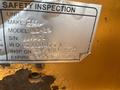 2017 Ford F-550 pickup truck with a safety inspection label attached displaying unit make model serial number and inspection details