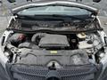 A 2018 Mercedes-Benz Metris with its hood open revealing a dusty engine compartment and leaves scattered inside