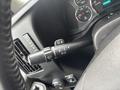 Close-up of the turn signal and wiper control stalk on the steering column of a 2022 GMC Savana