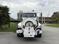 Front view of a 2016 Peterbilt 348 equipped with a large circular tank and hose attachment designed for industrial use
