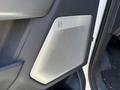 A close-up view of a B&O audio speaker grille located on the interior door panel of a 2023 Ford F-150