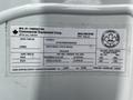 A 2012 Freightliner M2 106 vehicle identification label with specifications including weight, dimensions, and manufacturer details