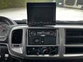 Dashboard of a 2020 Hino 338 featuring a digital display screen and a JVC car stereo with controls for air conditioning and audio settings