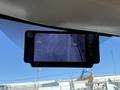 A rearview camera display showing a view of the ground outside a 2013 Chevrolet Express vehicle