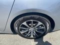 A close-up view of a gray 2017 Acura TLX wheel featuring a five-spoke alloy rim and a black tire with visible tread patterns