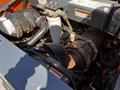 Close-up view of the engine compartment of a 2017 Gehl R105 showing the air intake system and various components including pipes and hoses