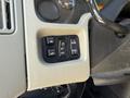 Control panel with four buttons labeled MIR OFF PANEL and LAMP on a 2010 International 4300