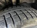 Close-up of a tire from a 2021 Ford Transit showing detailed tread patterns designed for traction and grip on various surfaces