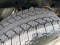 A close-up view of a tire from a 2018 Chevrolet Silverado 1500 showing its tread pattern and rubber surface