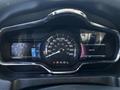 A dashboard of a 2013 Lincoln MKT displaying speedometer, fuel gauge, and entertainment screen with various information and indicators