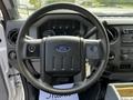 Steering wheel and dashboard of a 2016 Ford F-550 displaying gauges controls and audio system