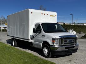A 2019 Ford Econoline box truck in white with a large enclosed cargo area and a silver front grille