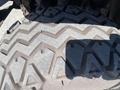 Close-up of a rugged tire tread pattern on a 2018 Kubota RTV-X 1100 C highlighting its traction design and durability