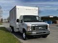 A white 2013 Ford Econoline box truck with a large cargo area and a front grille featuring a horizontal bar design