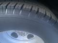 Close-up of a tire from a 2017 Chevrolet Express showing the tread pattern and a portion of the wheel rim