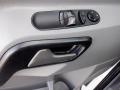 Close-up of the door handle and window control panel of a 2016 Mercedes-Benz Sprinter