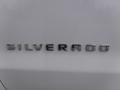 The word Silverado displayed in chrome letters on the tailgate of a 2015 Chevrolet Silverado 1500
