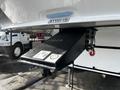 Close-up of the hitch and pin box of a 2021 Grand Design Recreational 311BHS trailer with model number clearly visible