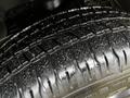 Close-up of a wet tire of a 2022 RAM 1500 Classic showing detailed tread patterns and grooves