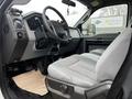 Interior view of a 2015 Ford F-550 featuring the steering wheel dashboard and driver's seat