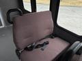 A brown fabric seat with a black safety belt designed for a 2014 Ford E-350 van