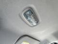 Interior overhead light panel of a 2016 Ford Transit featuring a rectangular light fixture and three control buttons