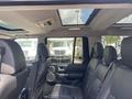Interior view of a 2006 Land Rover LR3 showing black leather seats and a panoramic sunroof