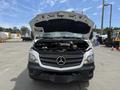 A 2016 Mercedes-Benz Sprinter van with its hood open displaying the engine compartment and front grille featuring the Mercedes-Benz logo