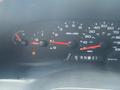 Dashboard of a 2004 Ford Econoline showing speedometer fuel gauge and warning lights