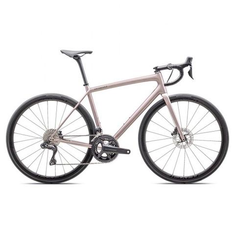 A Specialized Aethos Pro Shimano Ultegra Di2 2025 road bike in a light pink finish featuring drop handlebars disc brakes and a sleek design