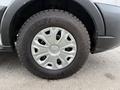 Close-up of a 2022 Ford Transit wheel showcasing an alloy rim with a silver finish and a Good Year tire with a rugged tread pattern