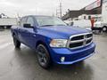 A blue 2019 RAM 1500 Classic pickup truck parked with a shiny finish and black wheels, featuring a chrome grille and prominent headlights