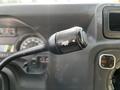 Close-up of the control stalk for windshield wipers inside a 2013 Ford Econoline van