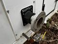 A close-up of a Huntair Custom Air Handler Unit featuring a metal supply connection with a rubber gasket and a valve beside it