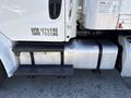 A 2015 Freightliner M2 106 showing the diesel fuel tank and steps leading up to the cab of the truck