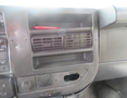 Interior view of a 2020 Chevrolet Express dashboard showing air vents and a section with missing paneling