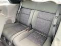 Interior seating of a 2007 Chrysler PT Cruiser featuring gray fabric upholstery with patterned seat designs and seatbelts