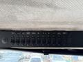 Dashboard panel of a 1998 Freightliner FL80 featuring multiple switches for various controls and lights