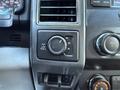 Dashboard controls of a 2019 Ford F-350 SD including a four-wheel drive selector dial and volume control knob