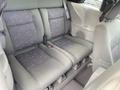 Interior view of a 2007 Chrysler PT Cruiser showing the backseat with two bucket seats and a center seatbelt